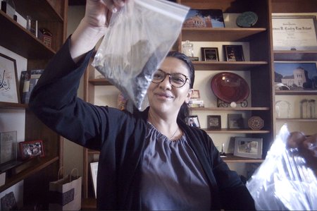 Former Michigan State Representative Rashida Tlaib with her petcoke samples in ziplock bags Bill Kubota